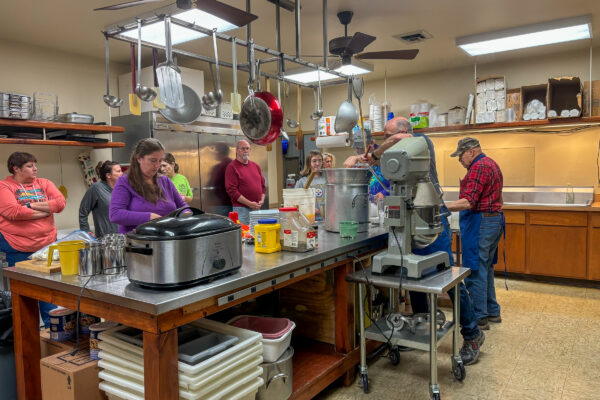 Volunteers prepare a banquet meal