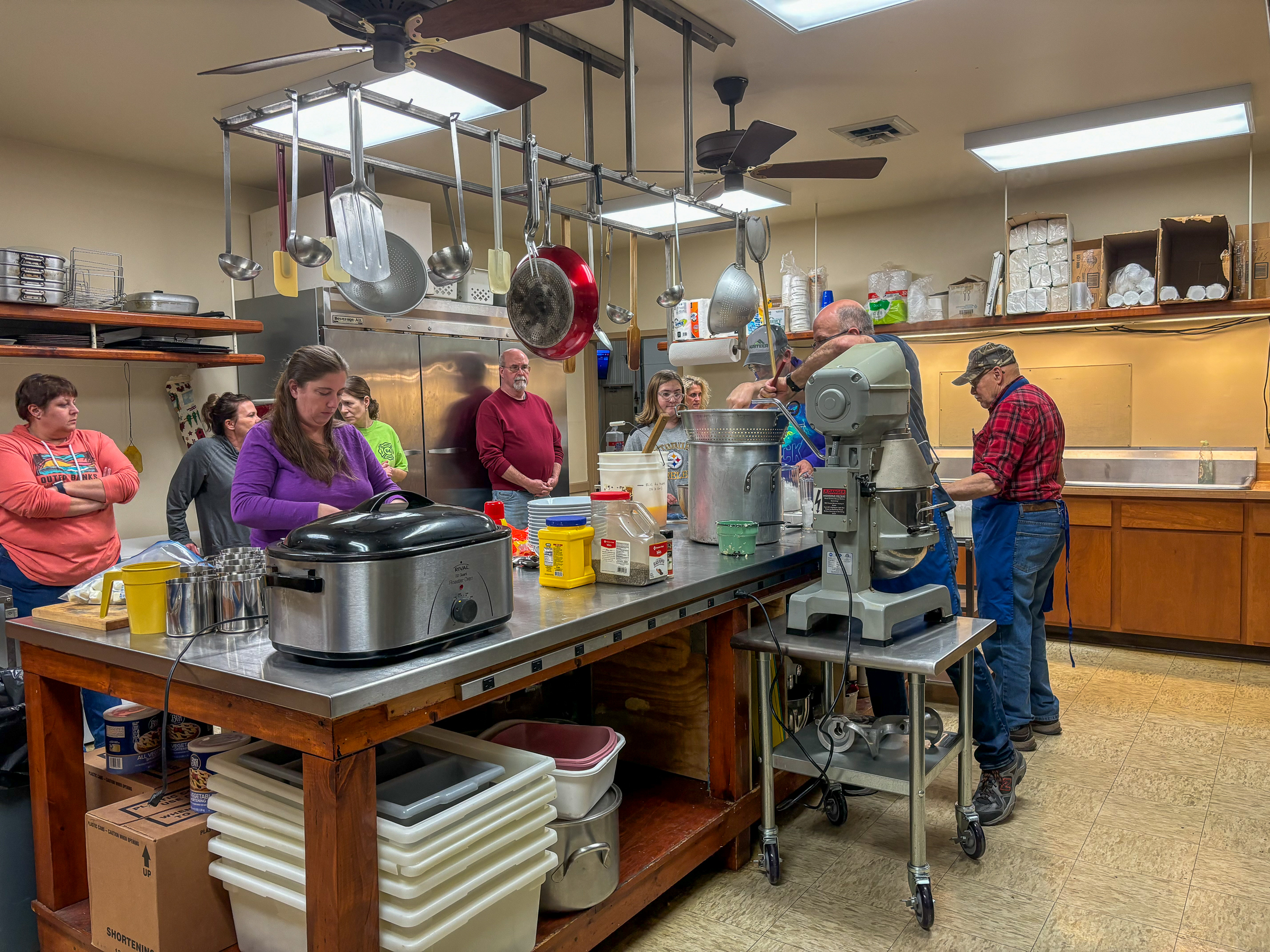 Volunteers prepare a banquet meal