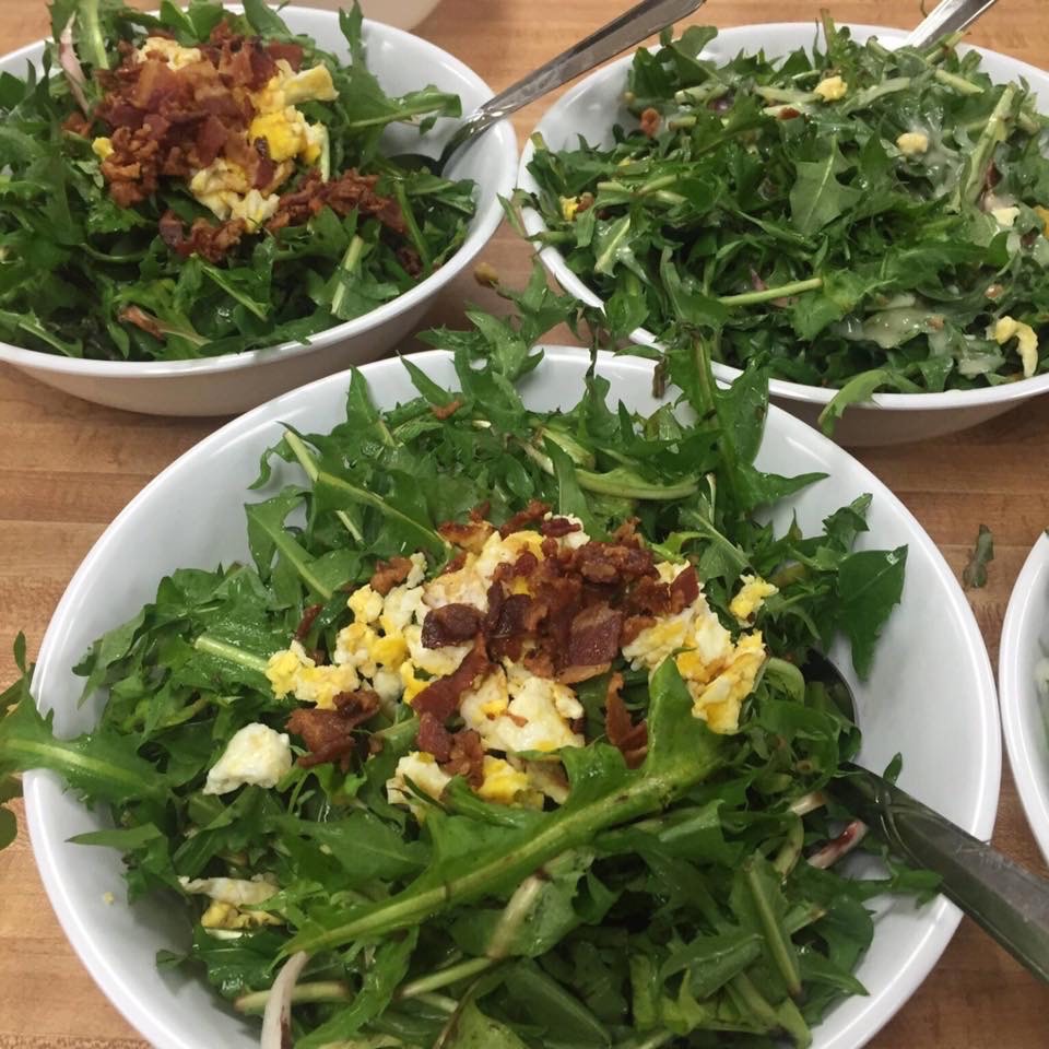 Dandelion, scrambled eggs and bacon ready to eat